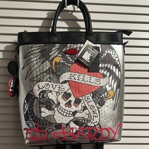 NWT Ed Hardy Love Kills Slowly Silver and Black Backpack Convertible.